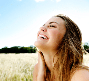 happy young girl smiling in sun